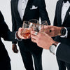 Groom and groomsmen wearing custom Nixon 51-30 Chrono watches making a toast with whiskey