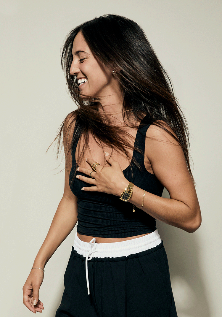 Young woman wearing the new Nixon women's watch, the Frankie