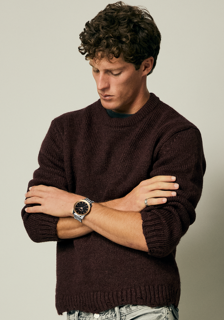 Man with arms crossed wearing a Nixon Corporal Stainless Steel analog watch