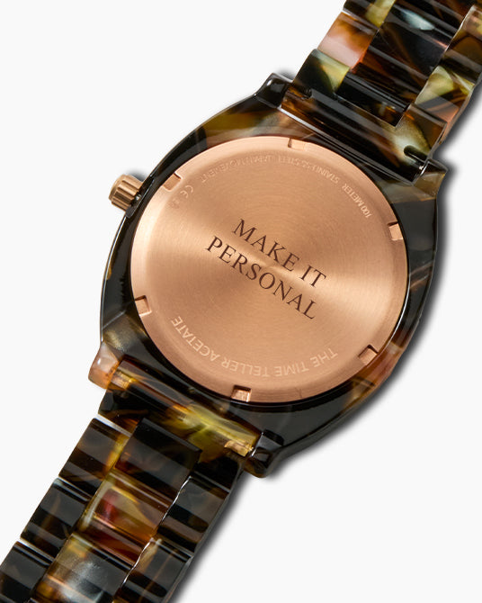 "Make it personal" engraved on the back of a Nixon Time Teller Acetate