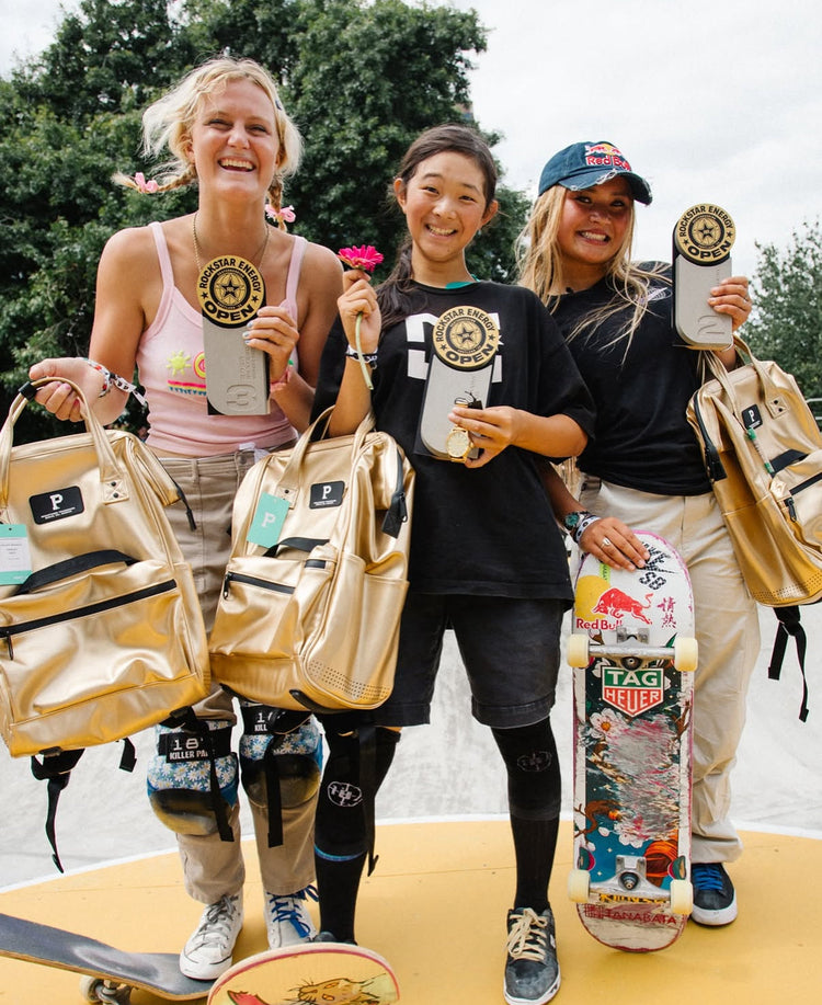 Three young skaters celebrate their awards