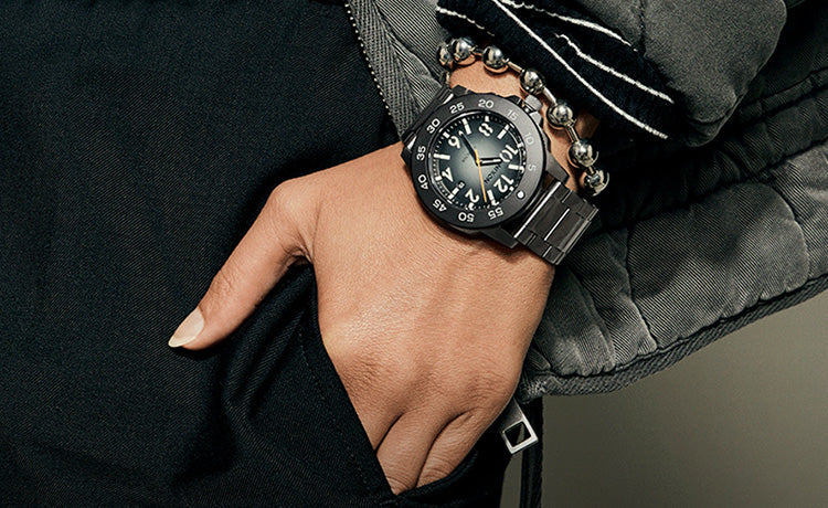 Woman wearing the Nixon Smyth 44 watch