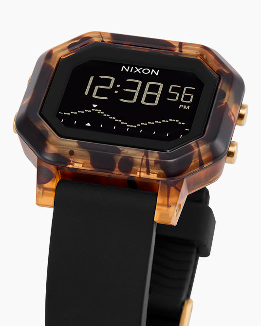Nixon watch with tortoiseshell case and black strap on white background