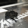 A black 51:30 watch Nixon designed in collaboration with the rock band Metallica.